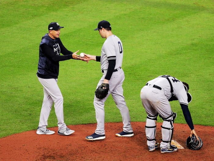 Oct 13, 2019; Houston, TX, USA; New York Yankees manager Aaron Boone (17) removes relief pitcher Adam Ottavino (0) during the fifth inning in game two of the 2019 ALCS playoff baseball series against the Houston Astros at Minute Maid Park. Mandatory Credit: Erik Williams-USA TODAY Sports